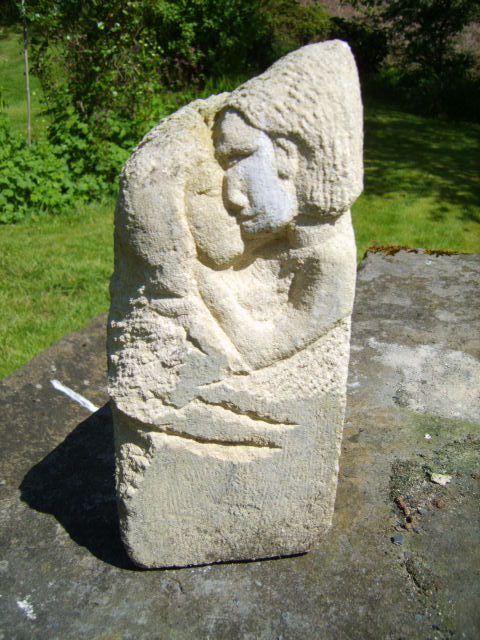 Embrace, a carving in Bath stone by Hilary Bryanston